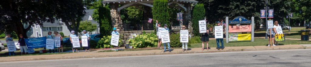 Walpole Peace and Justice Group standing on the sidewalks along the Walpole Common